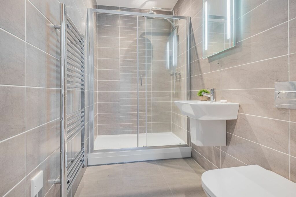 Wide bathroom with shower cabin. 