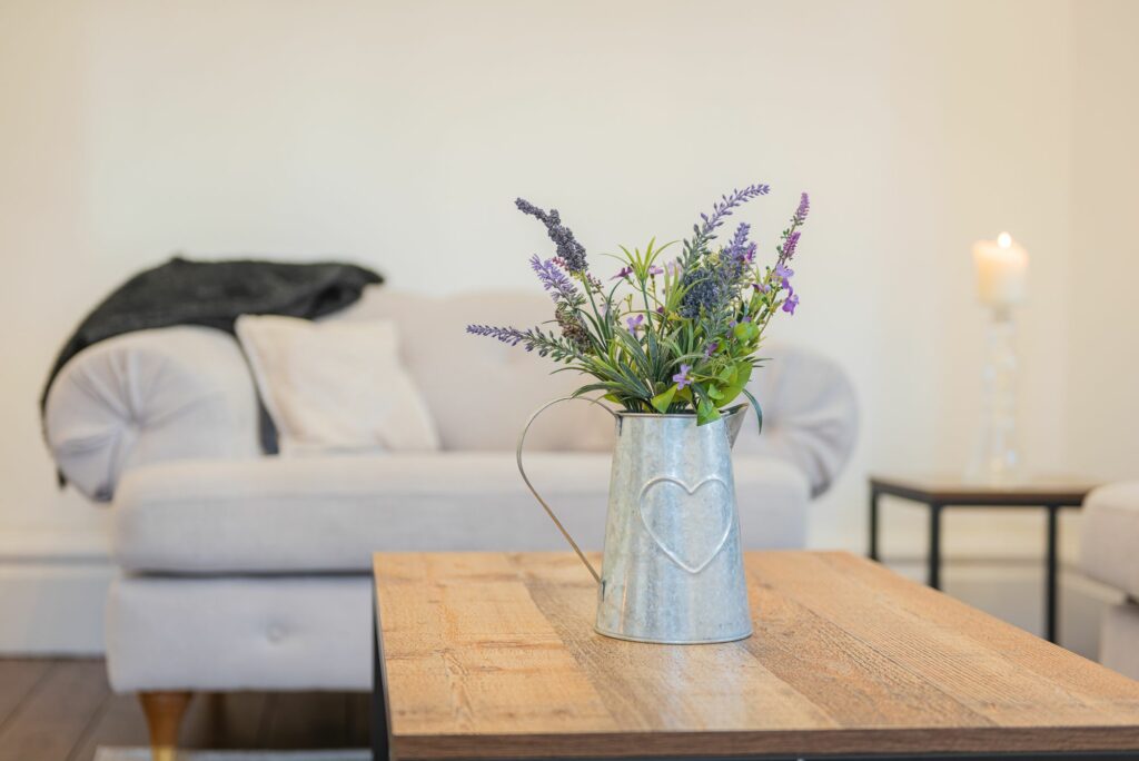 Fresh flowers in a vase on a table. 