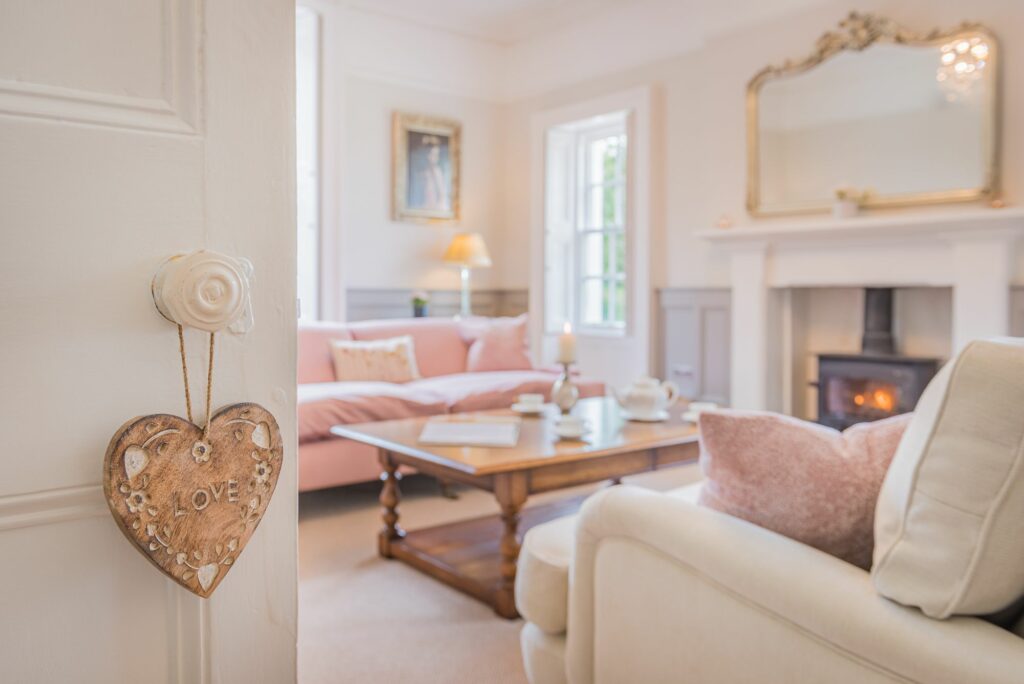 Living room with two sofas and a fireplace. 