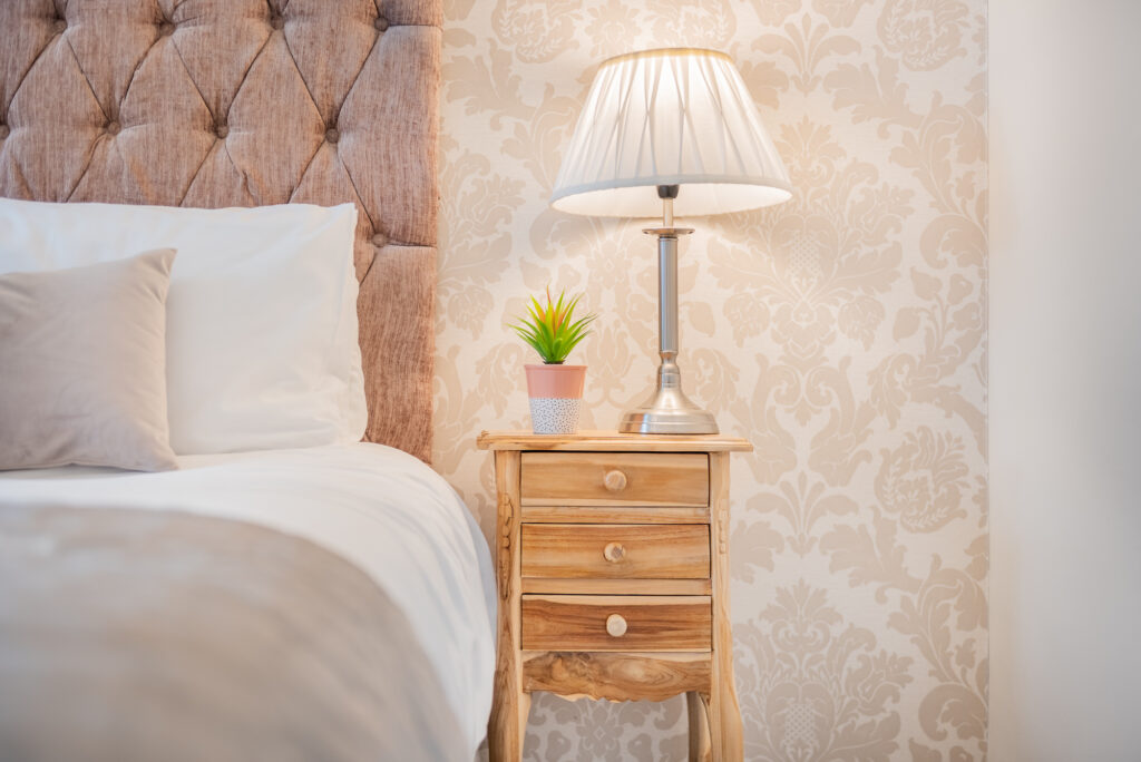 Bedroom corner with nightstand and lamp