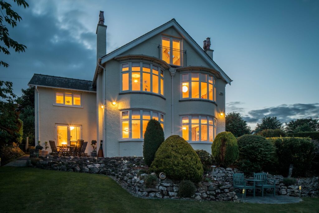 Exterior view of a house for sale with small patio 