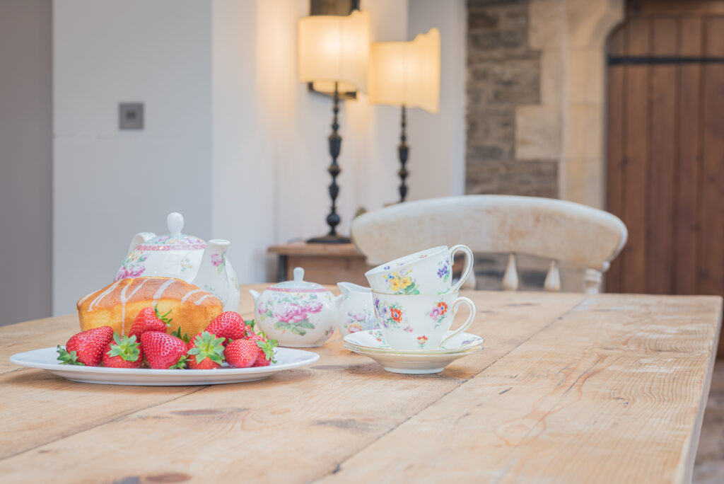 Tea cups and breakfast on kitchen table