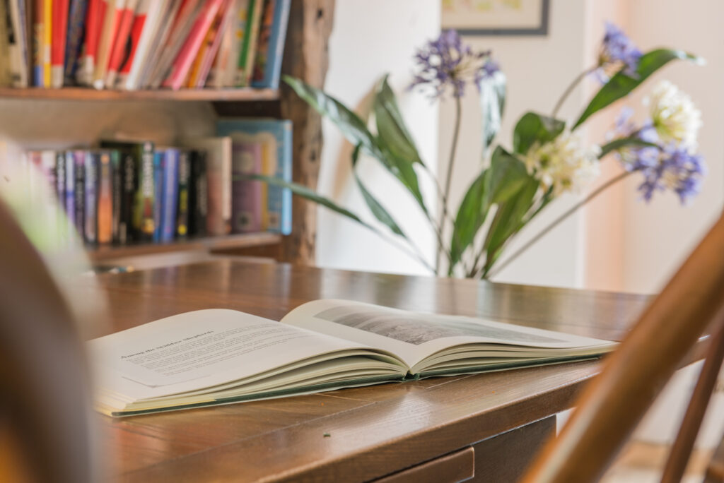 Table with open book on it.