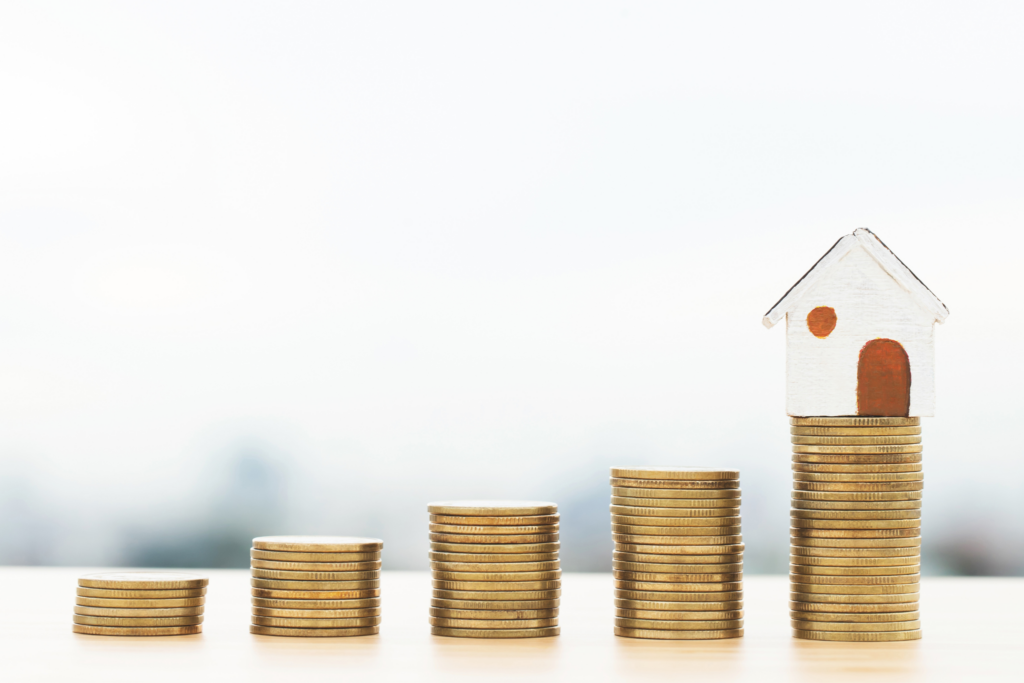 Coins stacks and a little house.