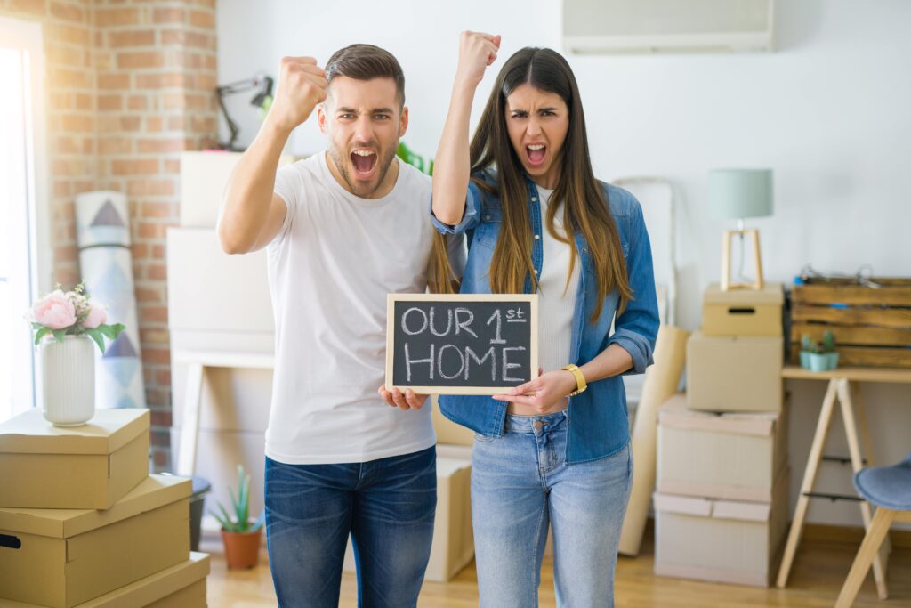 Couple celebrates their first home.