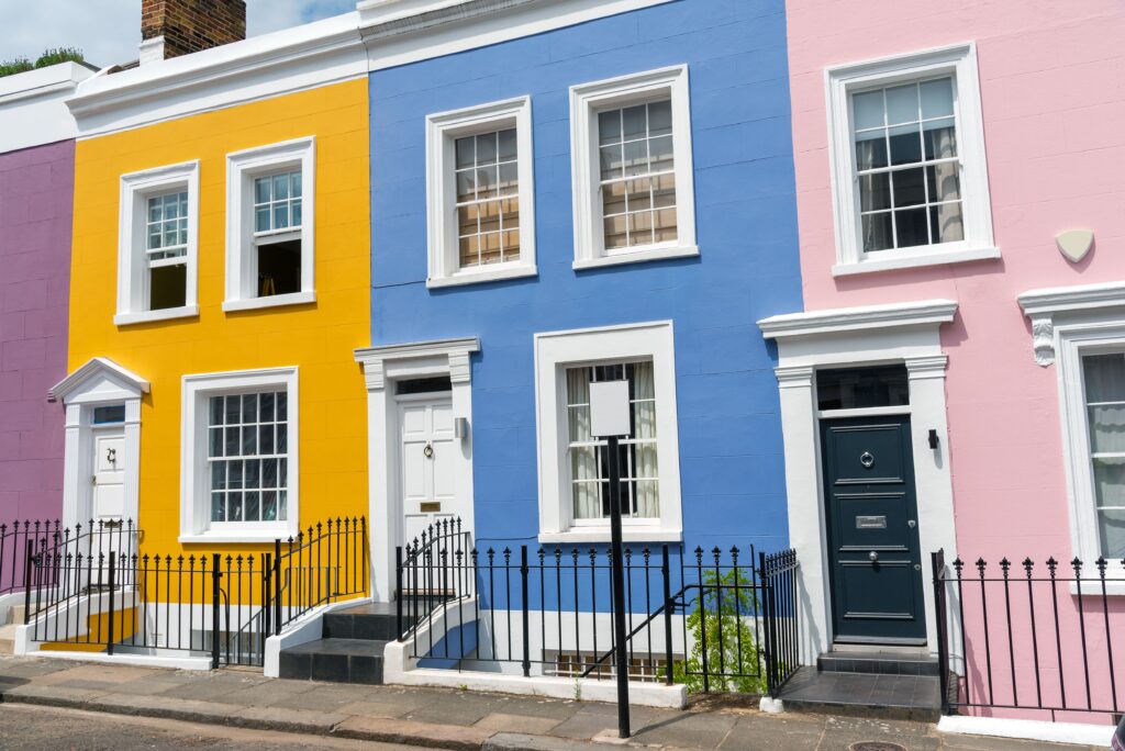 Exterior view of a 3 colorful buildings. 