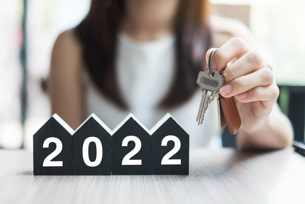 Woman holding keys to a new home. 