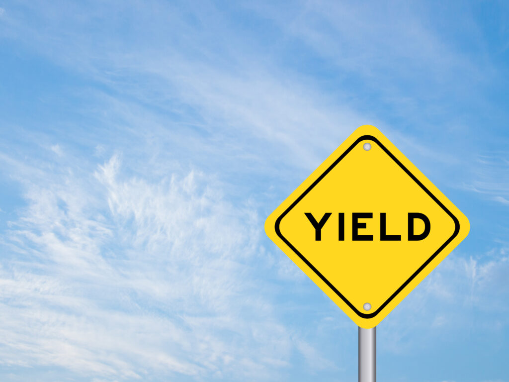 Yellow transportation sign with word yield