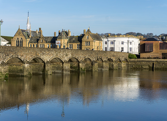 Landscape view of residential properties on a riverside.