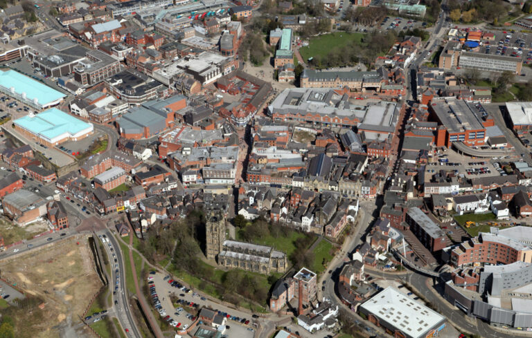 Aerial view of Wrexham town centre showing historic buildings and green spaces ahead of Christmas events