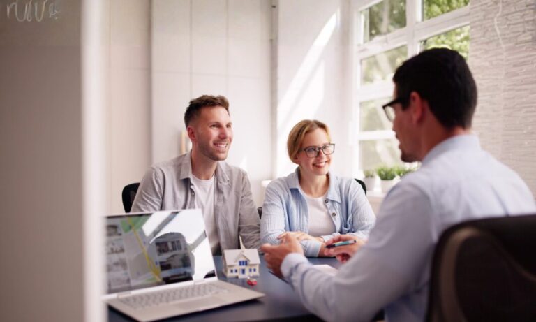 Landlord discussing a rental agreement with professional tenants in Wrexham’s high-demand industrial area