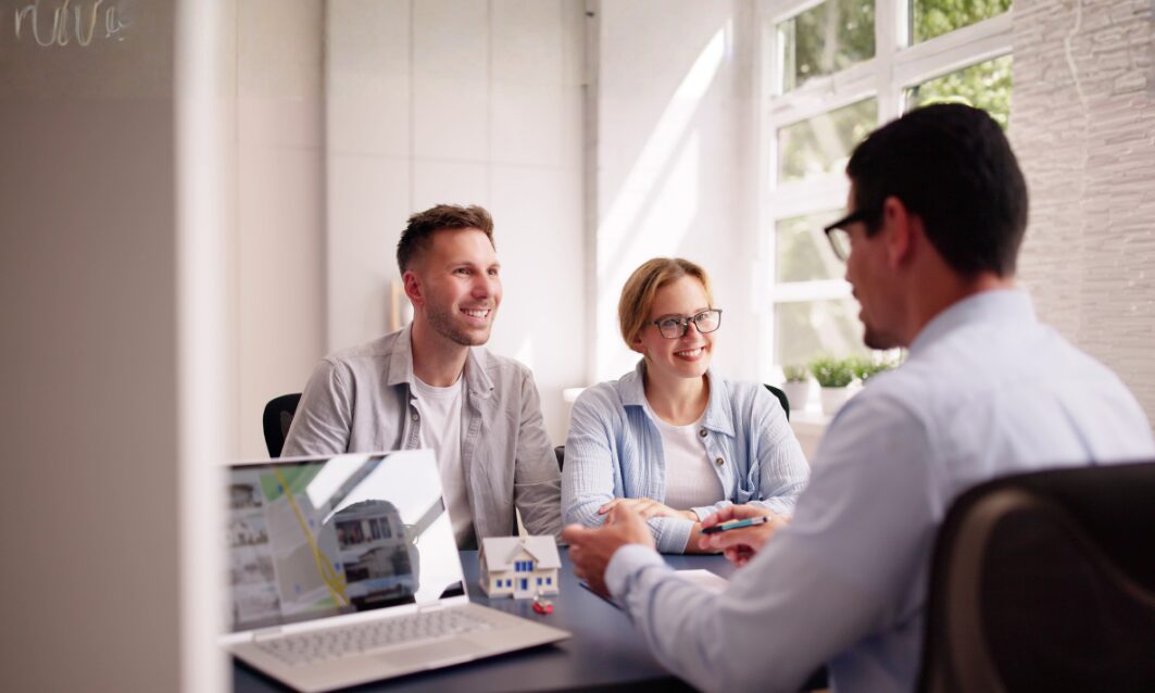 Landlord discussing a rental agreement with professional tenants in Wrexham’s high-demand industrial area
