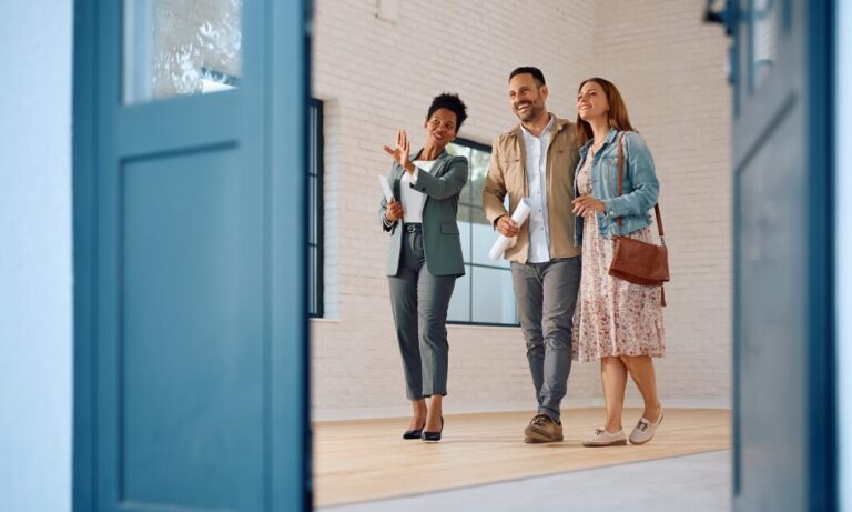 Letting agent giving a property viewing to a professional couple in Northampton