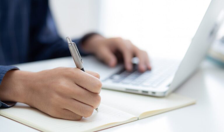 Landlord reviewing tenant application and making notes