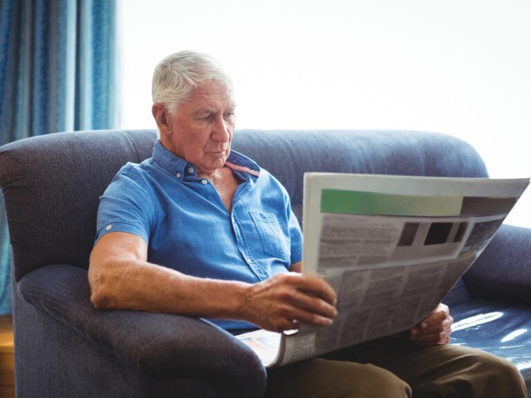 Landlord reviewing paperwork about ending a tenancy before selling a rental property or moving back in