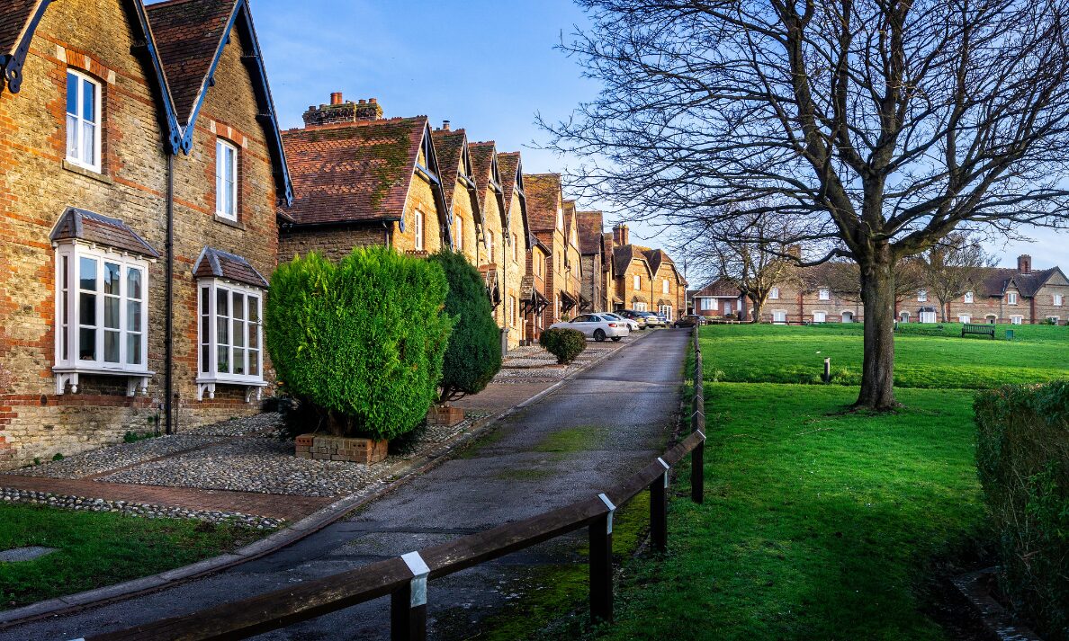Traditional brick residential homes and green open space in a Portsmouth neighbourhood