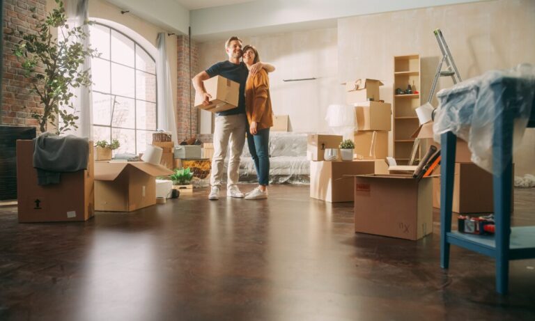 Young couple unpacking boxes in a newly purchased home in Warminster