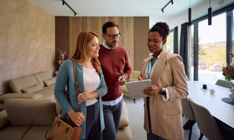 Estate agent showing a modern home to buyers in Heworth YO31