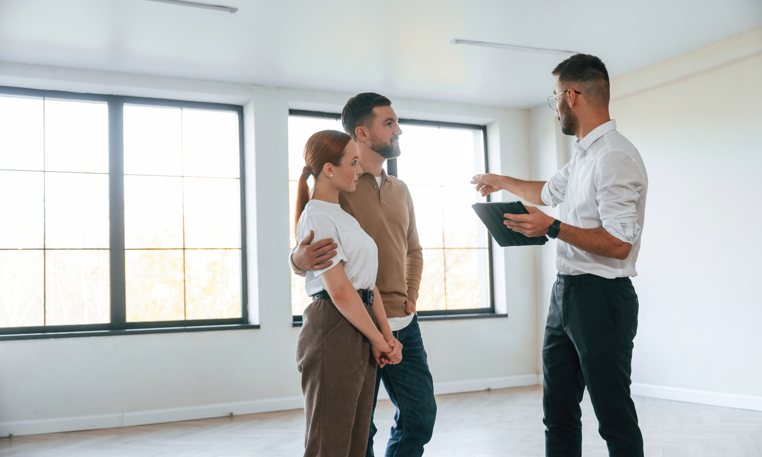 Couple viewing a rental property with a letting agent in Southport