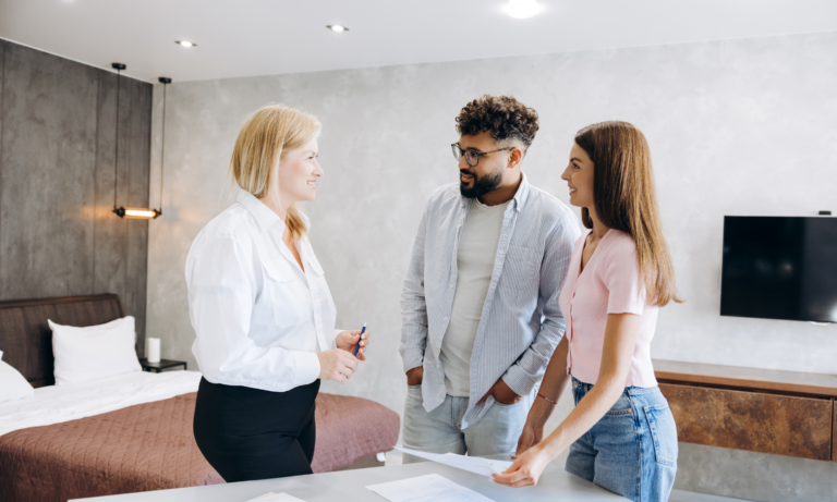 Couple discussing their property with an estate agent in Portsmouth