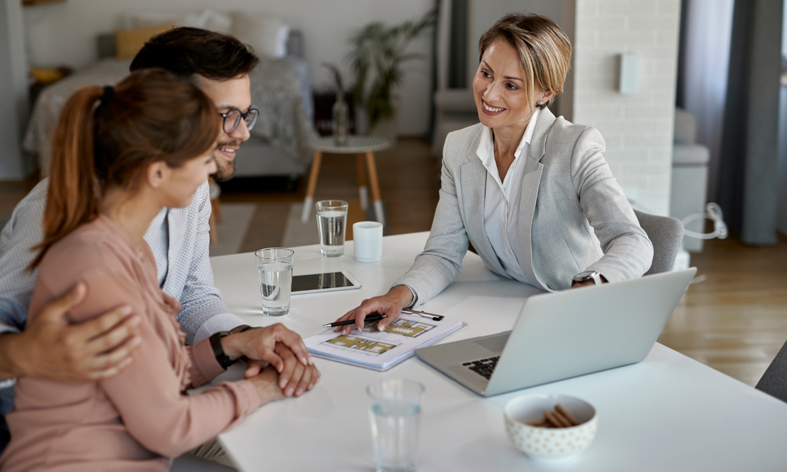 Property owners discussing rental management and guaranteed rent with a letting agent