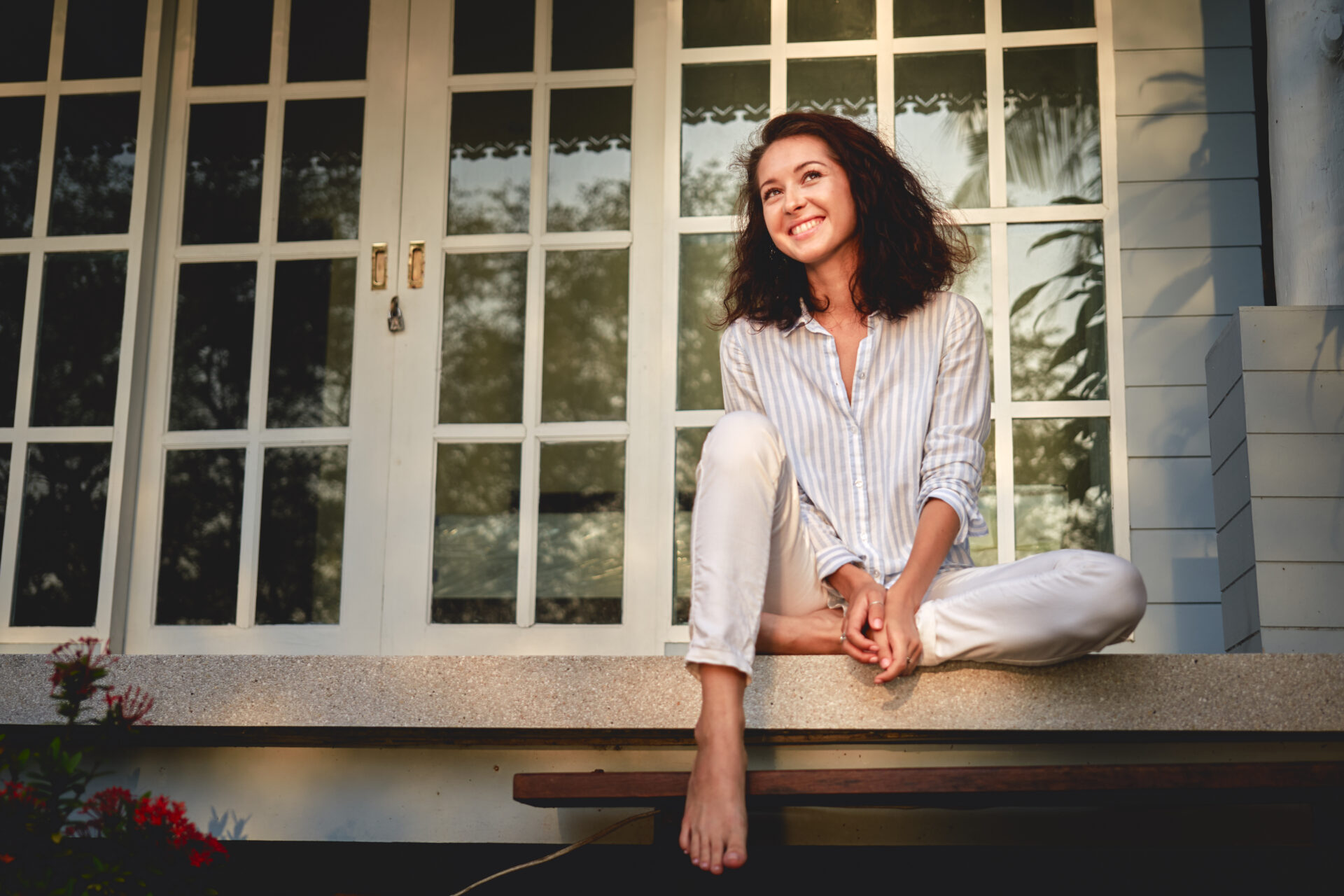 Prospective homeowner sitting outside a character property in Frome, Somerset.