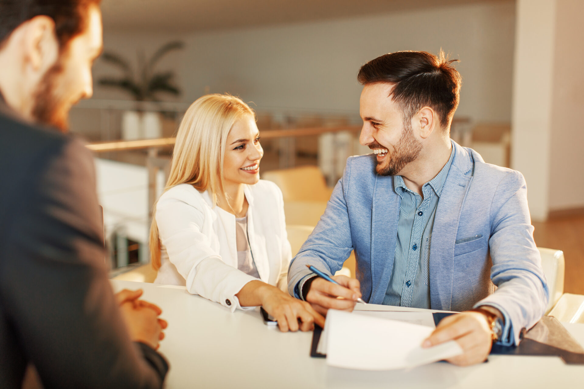 Property buyers meeting with an estate agent to discuss buying a home in Southport.