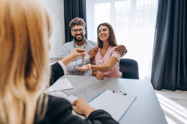 Couple receiving property keys from a letting agent
