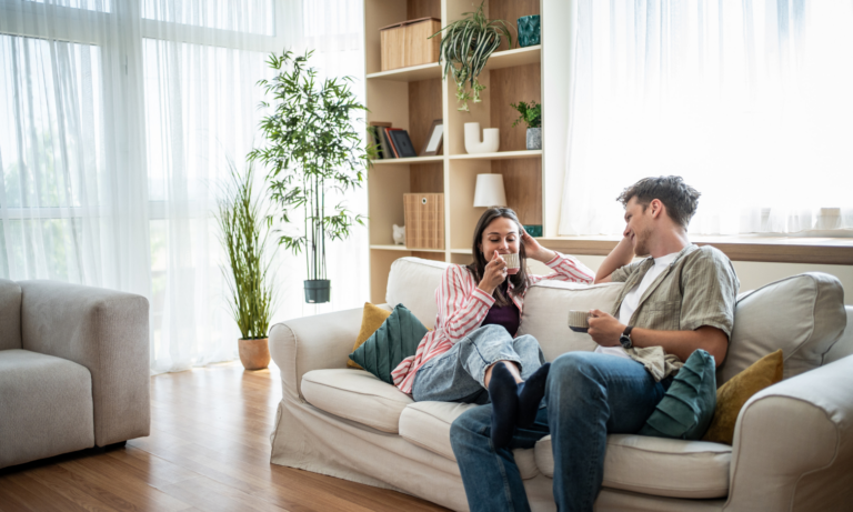 Young couple relaxing together in their new home in Liverpool