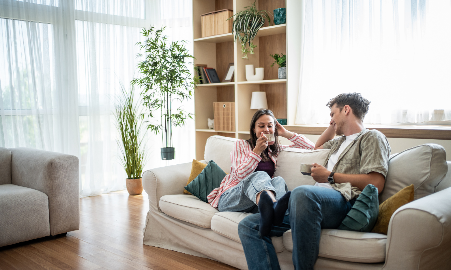 Young couple relaxing together in their new home in Liverpool