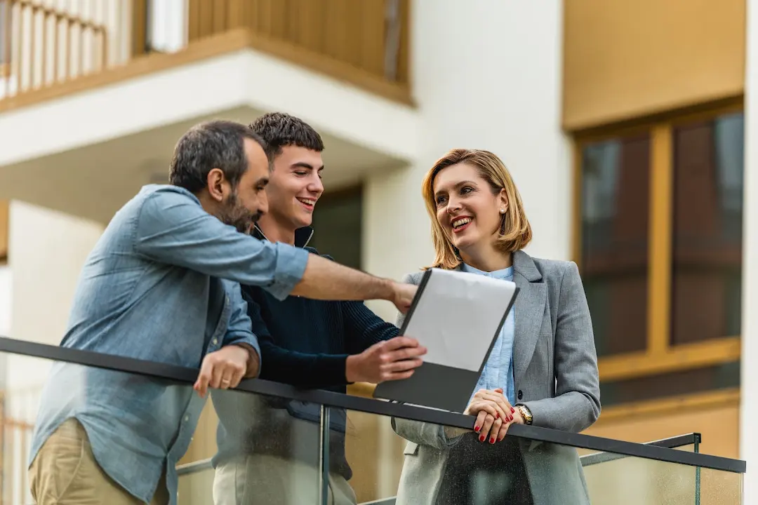 Property agent discussing guaranteed rent and property management options with landlords in Newcastle