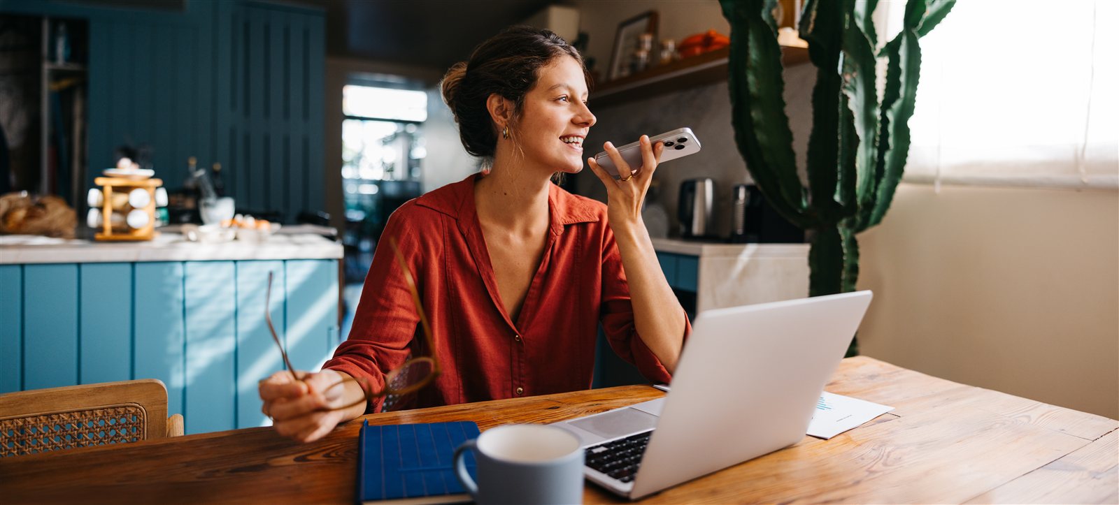 Landlord reviewing documents on a laptop at home