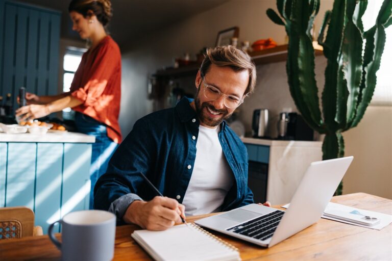 Property investor working on finances at home