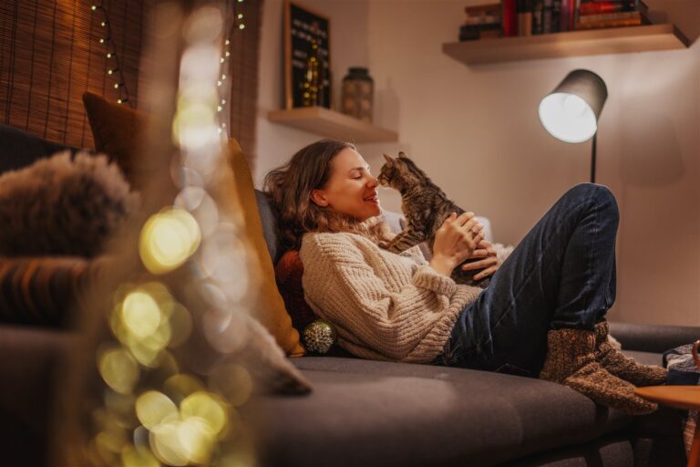 Tenant relaxing with a pet in a rented home