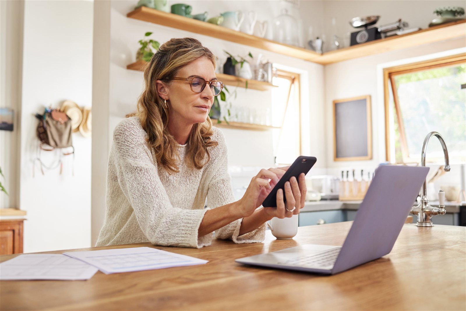 Landlord reviewing rental property paperwork at home
