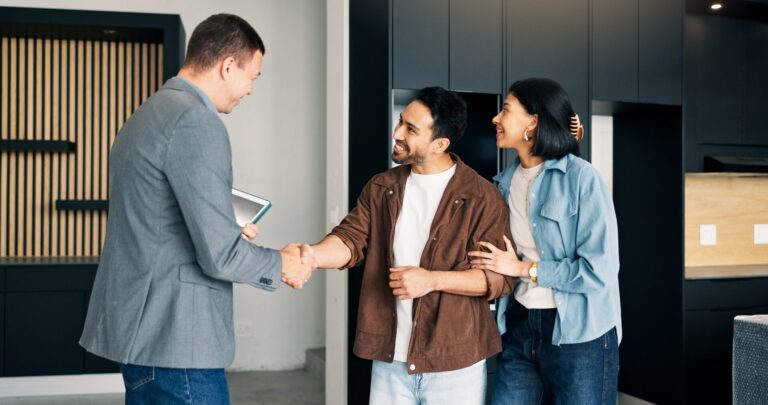 Couple shaking hands with a Northwood agent after agreeing a property purchase in Hull
