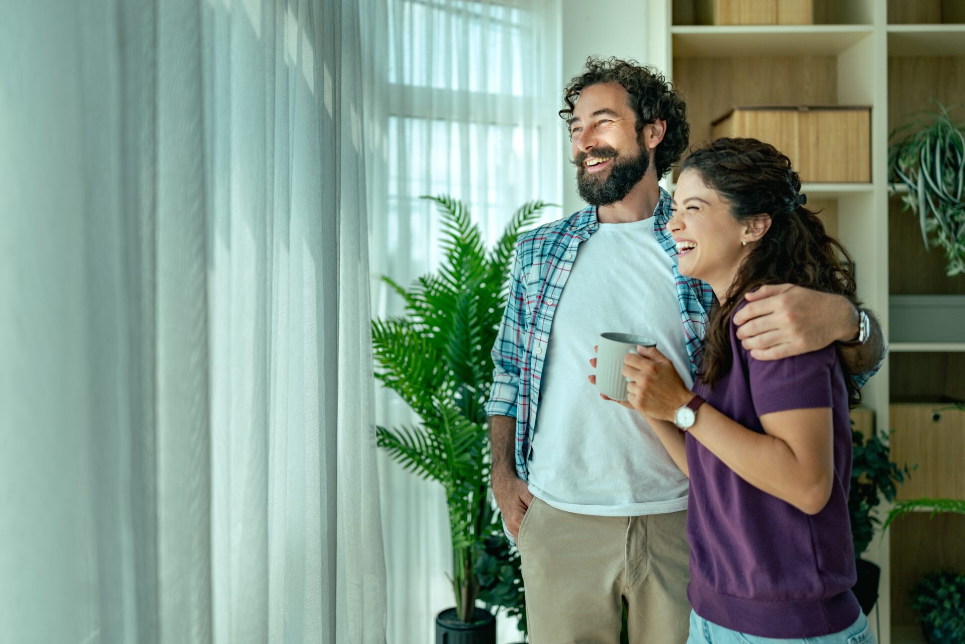 Happy young couple celebrating buying their first home in Portsmouth