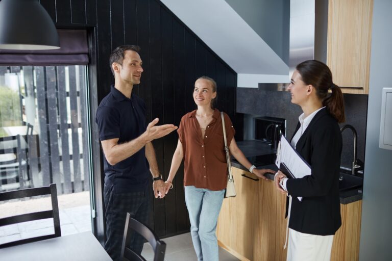 Estate agent discussing a home sale with owners in St Albans